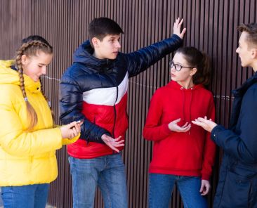 Teenage,Friends,Spending,Time,Together,In,City,Streets,In,Spring,